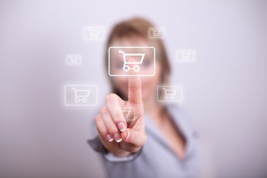 Woman pressing mdoern shopping button with one hand clipart