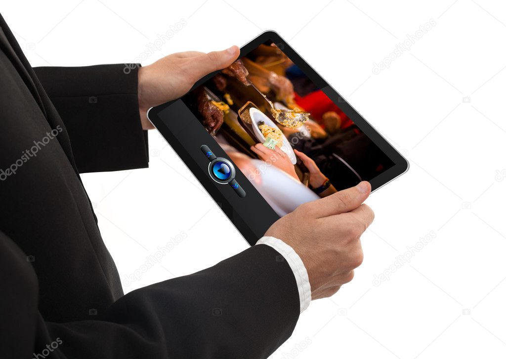 A male hand holding a touchpad media player