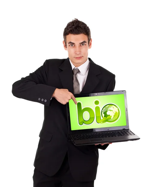 Деловой человек указывает на ноутбук с био-табличкой — стоковое фото