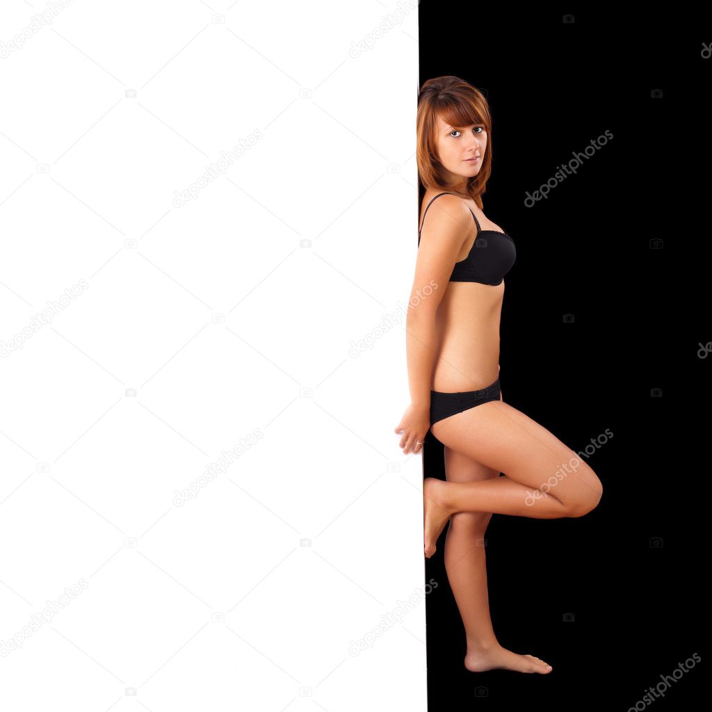 Sexy girl behind wall