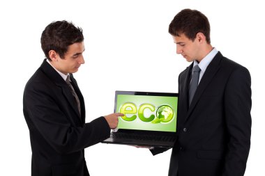 Business man pointing at eco laptop clipart