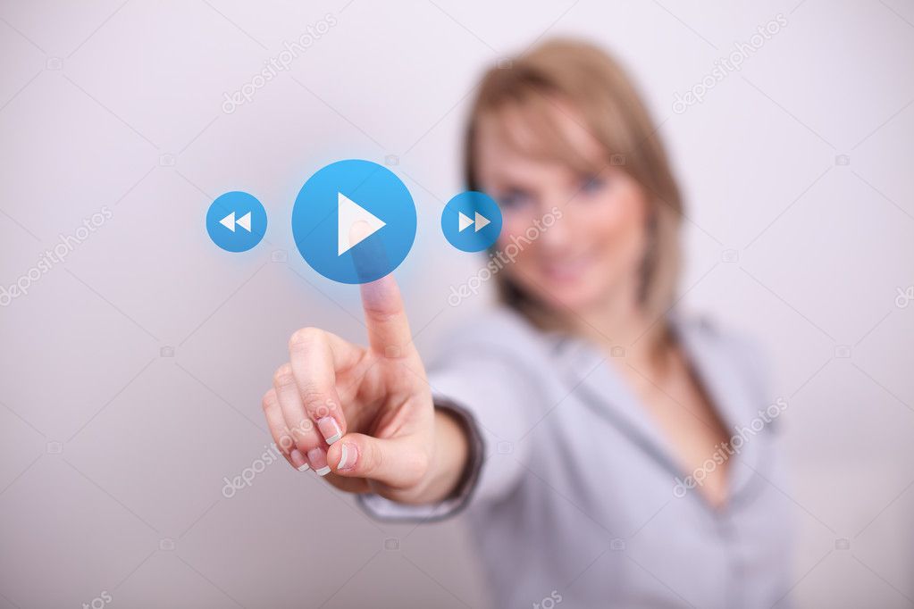 Woman pressing play and media button