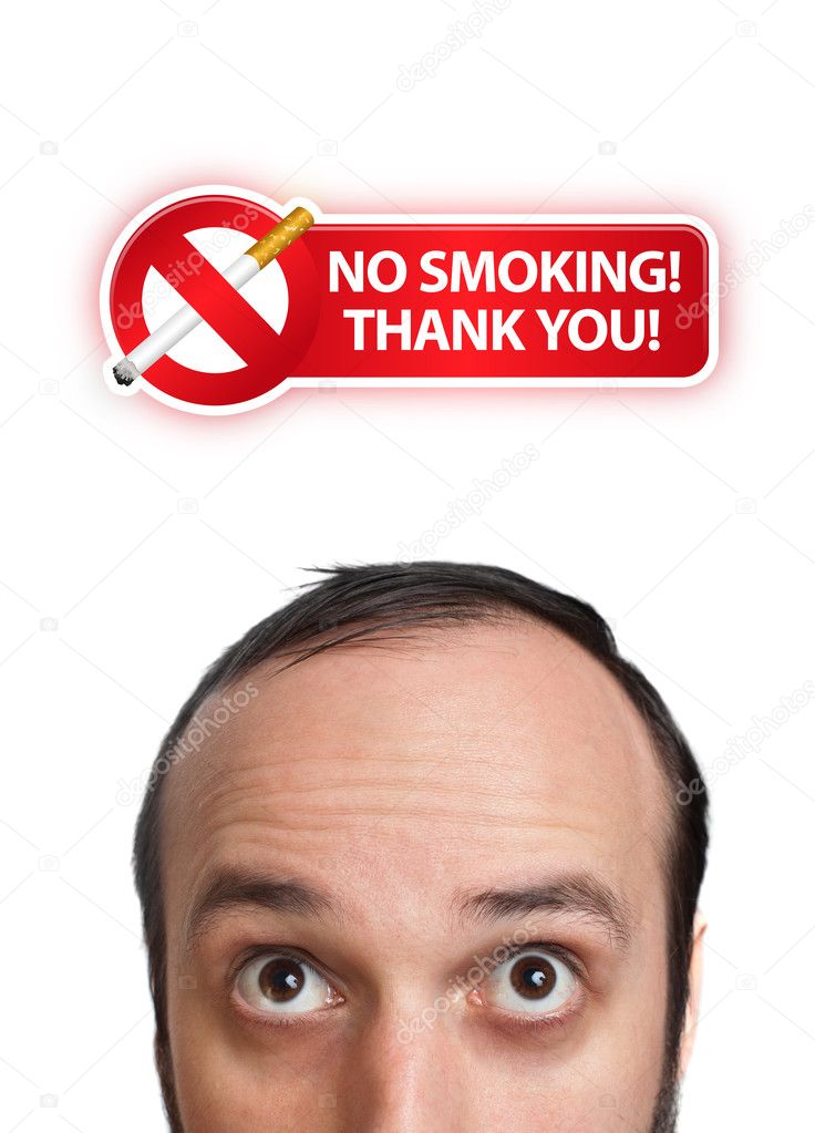 Young man with NO SMOKING sign over his head 2
