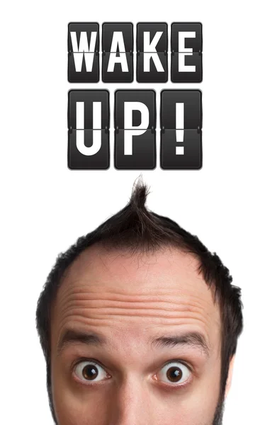 Funny Young man with wake up sign over head — Stock Photo, Image