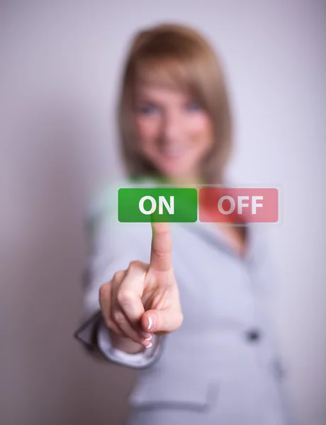 Woman pressing ON OFF button — Stock Photo, Image