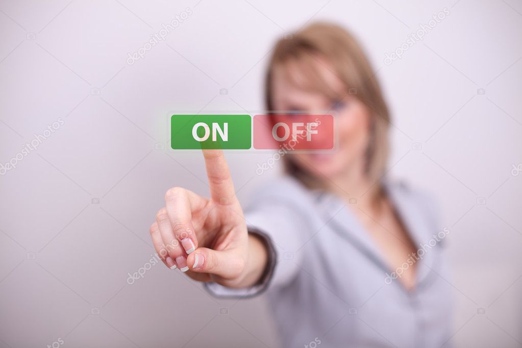 Woman pressing on off button