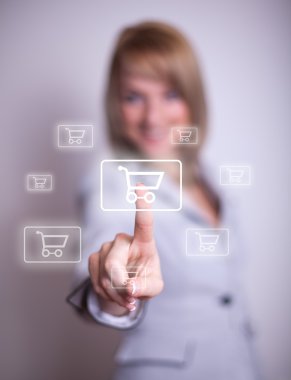 Woman pressing shopping cart icon clipart