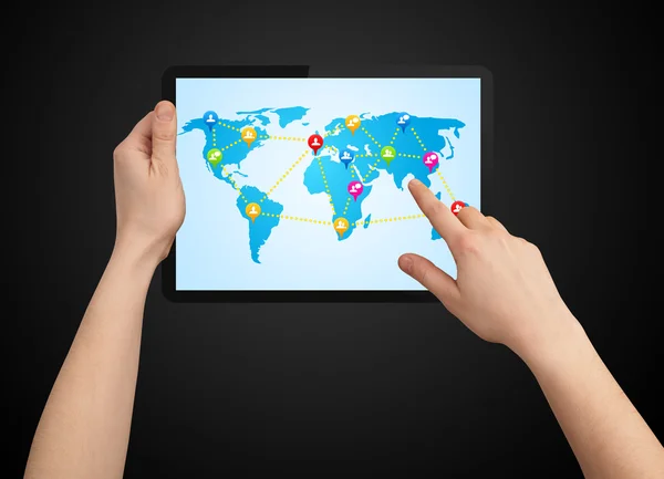 A male hand holding a modern touchpad with social map — Stock Photo, Image