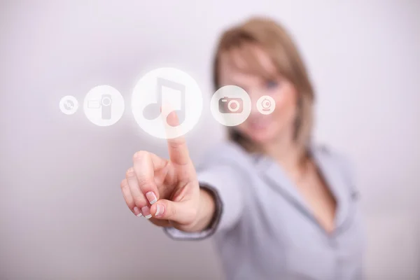 Woman pressing music button with one hand — Stock Photo, Image