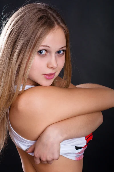 Young Girl Takes Shirt Black Background — Stock Photo, Image