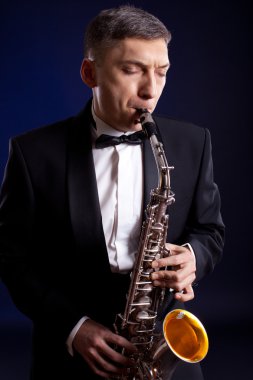 Man playing sax with expression clipart