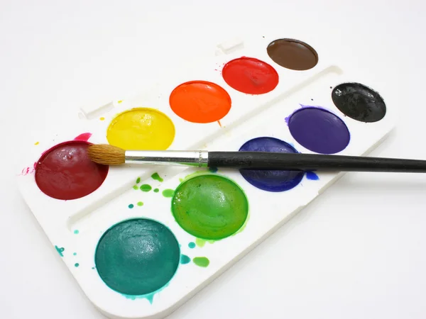 Tintas com escovas — Fotografia de Stock