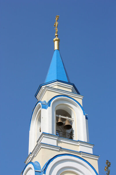 Christian church with dark blue domes of white color against the dark blue sky