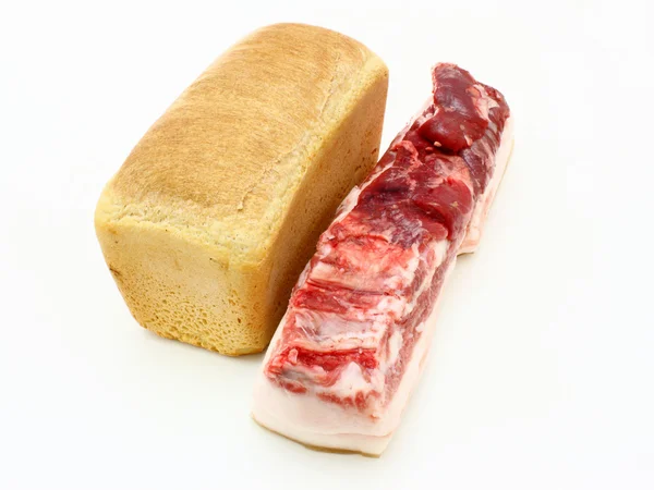Roll of fresh bread and the big piece — Stock Photo, Image