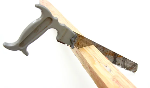 Hacksaw in sawed yellow wooden — Stock Photo, Image