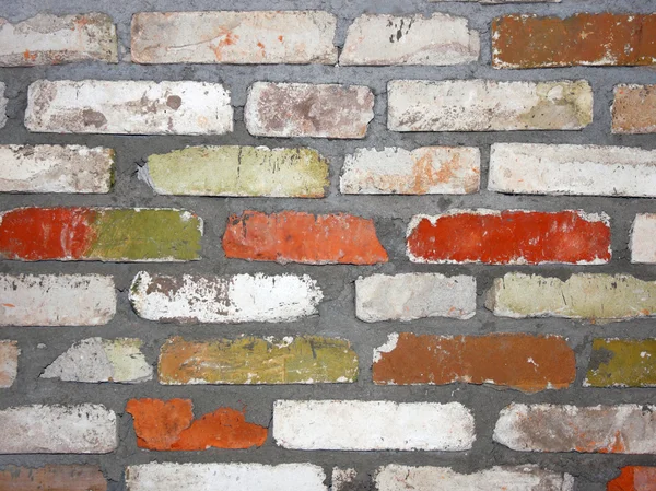 Stará zeď skládající se z cihel různé barvy — Stock fotografie