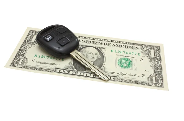 The car key lies on a dollar denomination — Stock Photo, Image