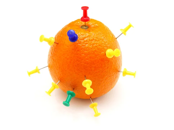 stock image Isolated colourful office pins thrust in an orange