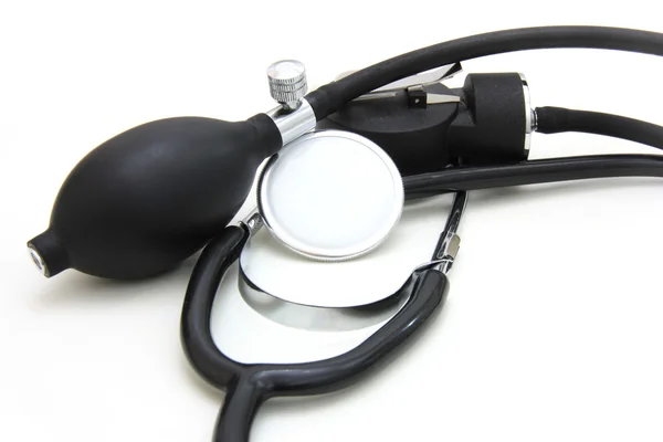 Den medicinske stetoskop på en hvid baggrund - Stock-foto