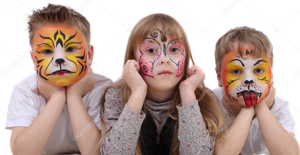Children with drawings on the face of the tiger dog and butterfly