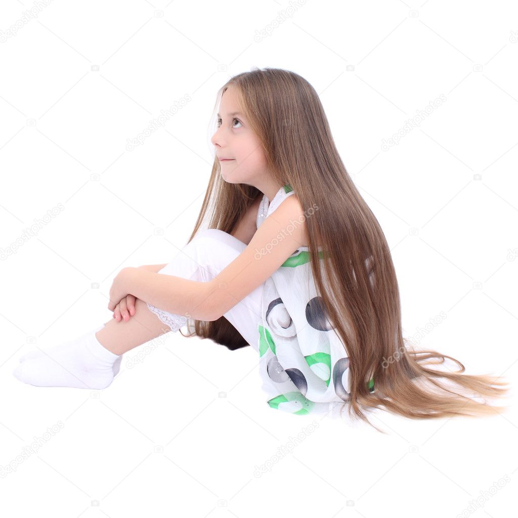 Girl-length dark hair sitting isolate Photo