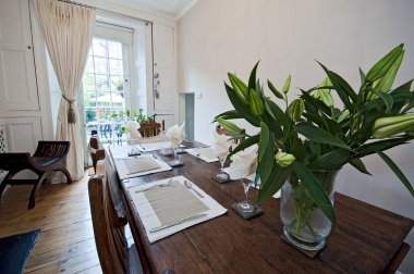 Dining room with massive wood furniture clipart