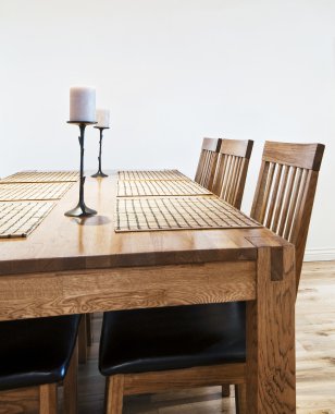 Six seat massive wood dining table with chairs clipart