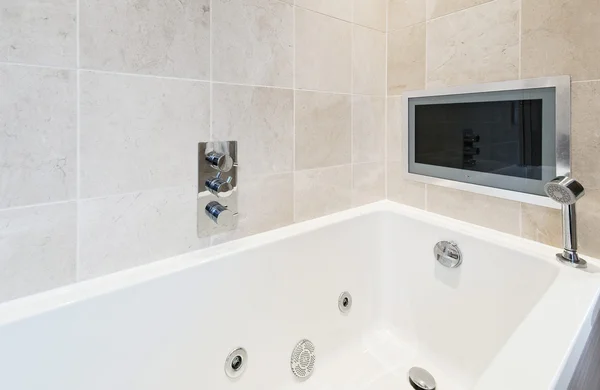 Bath tub with tv — Stock Photo, Image
