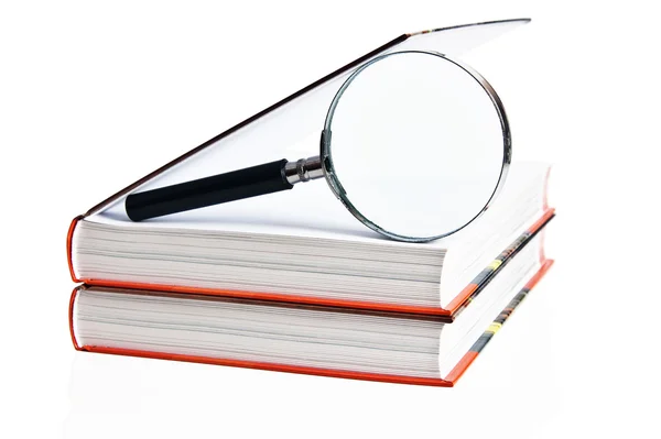 Two books and magnifier, it is isolated on white — Stock Photo, Image