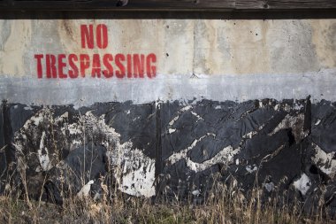 No trespassing on a cement wall clipart