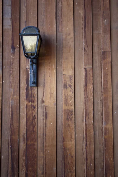 Wood siding with a lamp light — Stock Photo, Image
