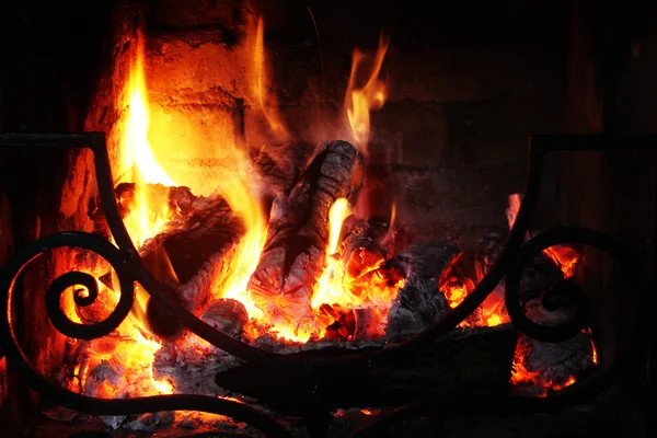 Fire in the fireplace with a lattic — Stock Photo, Image