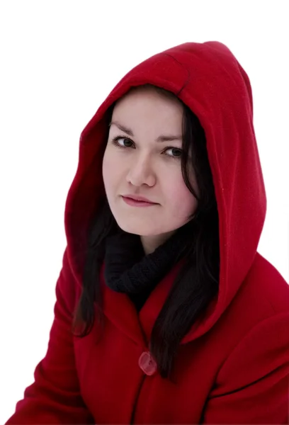 Ragazza in cappotto rosso su uno sfondo bianco — Foto Stock