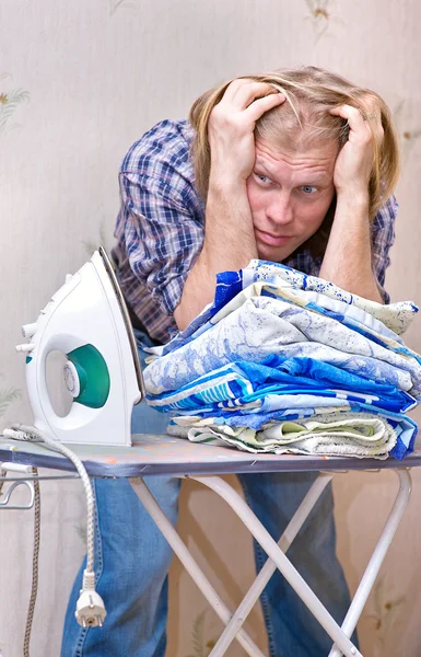 stock image Man does not want ironing clothes