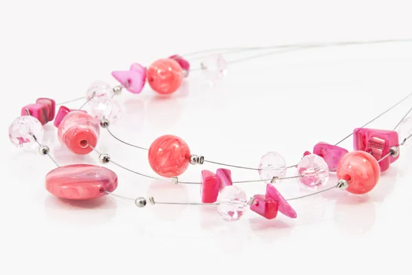 stock image Jewellery from red beads on glass