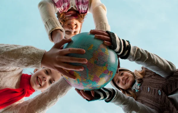 stock image Girls holding a globe