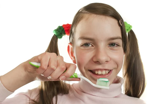 stock image Teen girl with toothbrush isolated on white