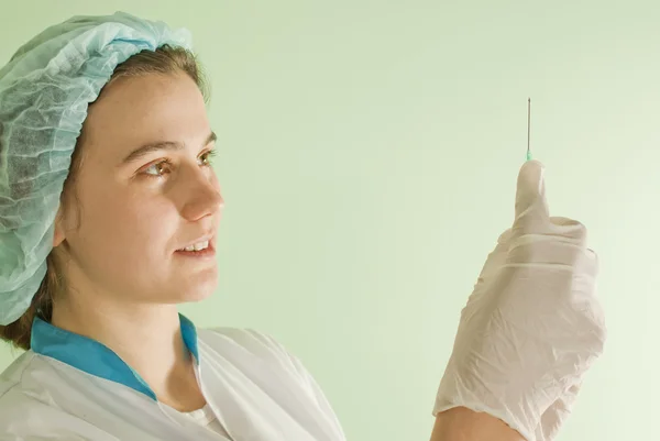 Young lady doctor with syringe — Stock Photo, Image