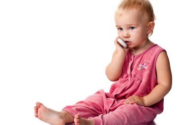 Baby talking on the mobile phone clipart