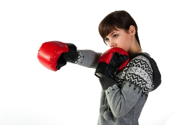 Beautiful girl in boxing gloves punching — Stock Photo, Image