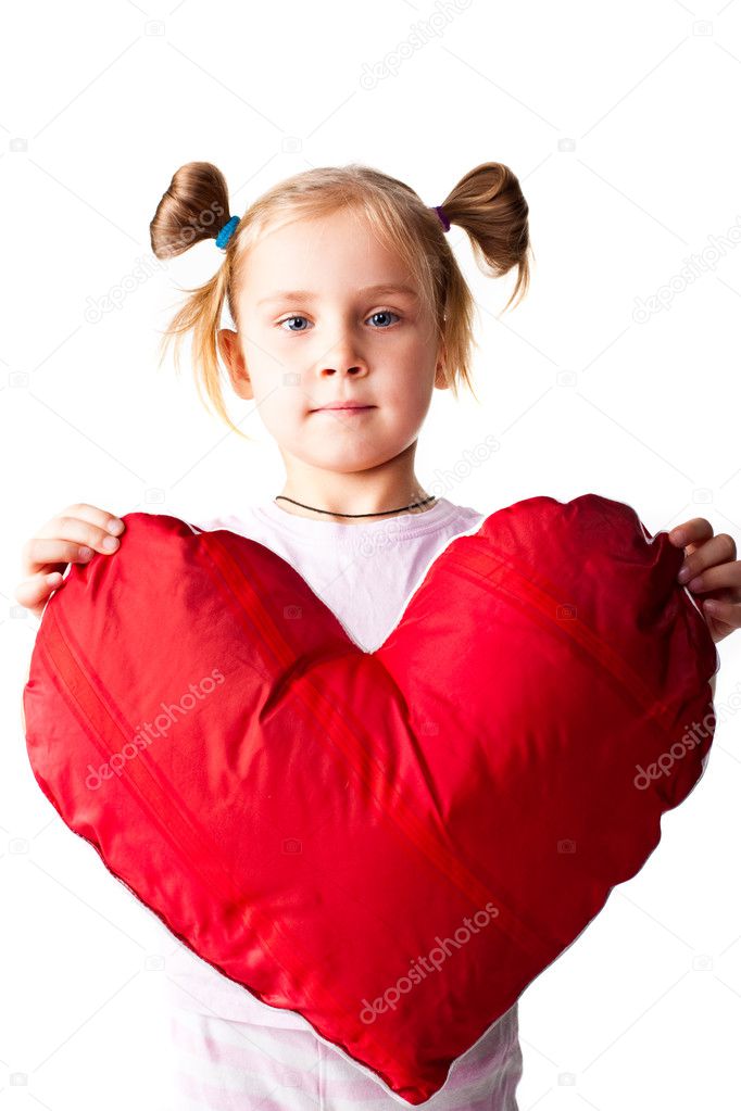 Beautiful girl giving a heart