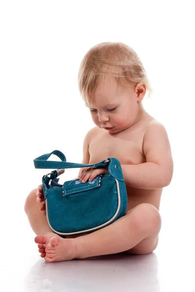 Baby looking into a small bag — Stock Photo, Image