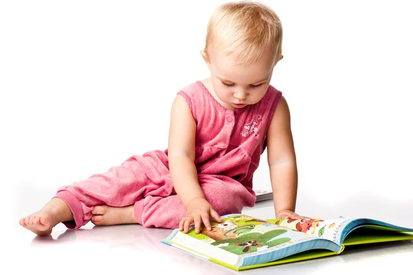 Beautiful baby girl reading a book — Stock Photo, Image