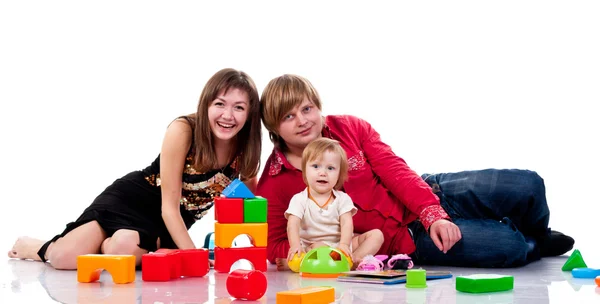 Família brincando com brinquedos — Fotografia de Stock