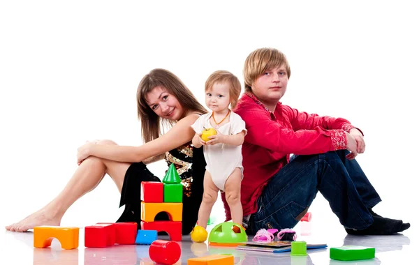 Familia jugando con juguetes — Foto de Stock