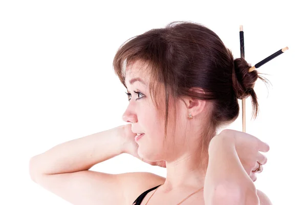 Beautiful young girl adjusting her hairstyle — Stock Photo, Image
