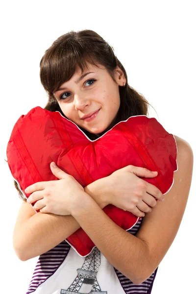 Beautiful girl holding a red heart — Stock Photo, Image