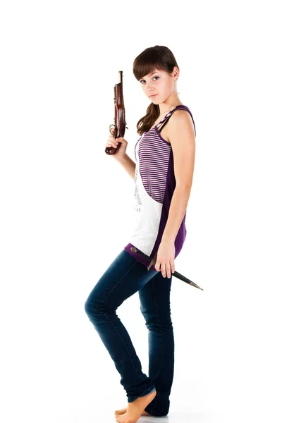 Beautiful girl with a gun and knife posing — Stock Photo, Image