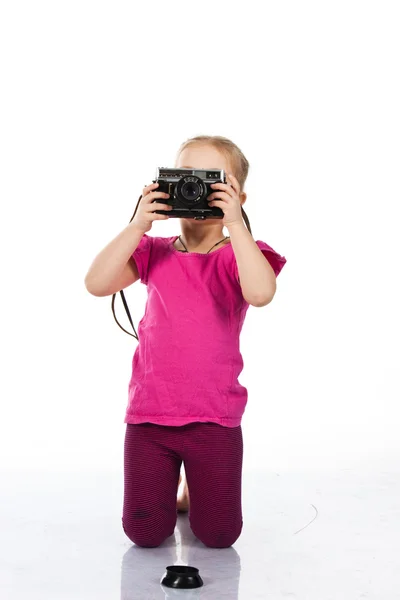 stock image Beautiful girl playing a photographer isolated on white