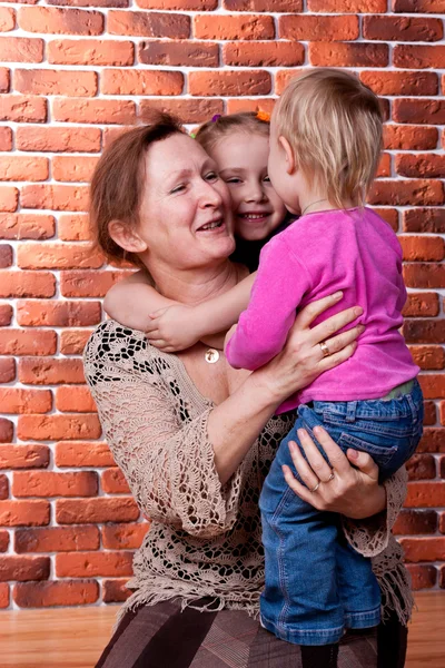 Grandmother playing with her grandchildren — Stock Photo, Image